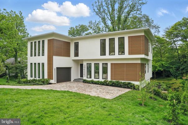 Attached, Backyard, Exterior, Facade, Brick Facade, Raised Ranch