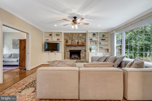 Fireplace, Interior, Living room, Recessed Lighting, Stone Walls, Wood Texture Flooring