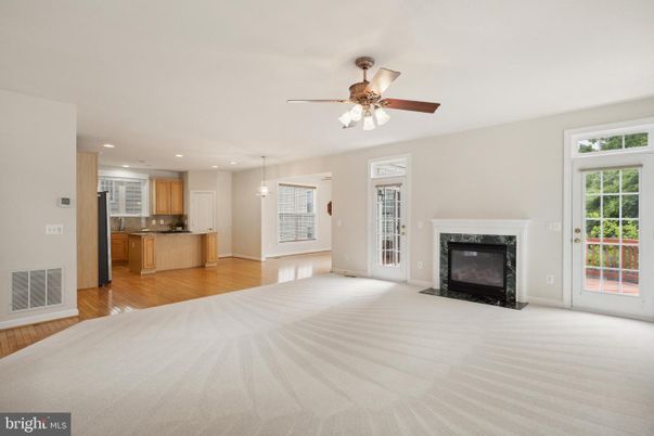 Empty room, Fireplace, Interior, Kitchen, Pendant Lights, Recessed Lighting, Wood Texture Flooring
