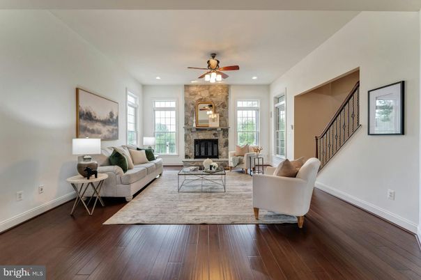 Fireplace, Interior, Living room, Recessed Lighting, Stone Walls, Wood Texture Flooring