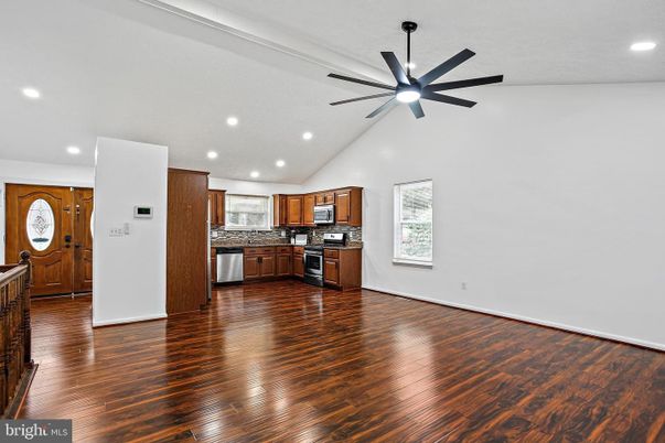 Empty room, Interior, Kitchen, Recessed Lighting, Stainless Steel Appliances, Wood Texture Flooring