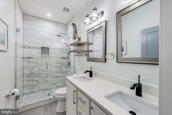 Bathroom, Dual Sink Vanities, Glass Shower, Interior, Marble Walls, Recessed Lighting