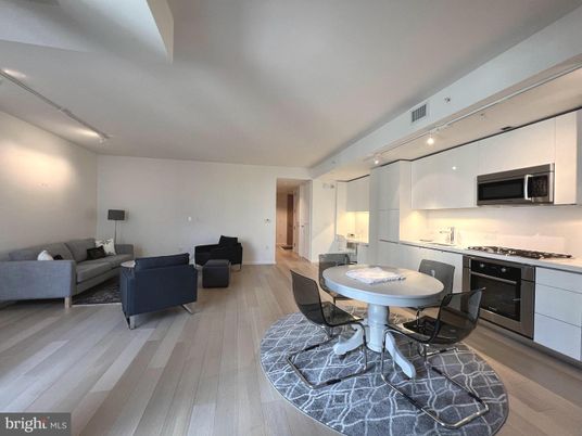 Dining room, Interior, Kitchen, Living room, Recessed Lighting, Stainless Steel Appliances, Wood Texture Flooring