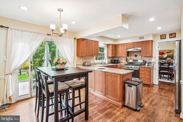 Chandelier, Dining room, Interior, Kitchen, Pendant Lights, Recessed Lighting, Stainless Steel Appliances, Wood Texture Flooring
