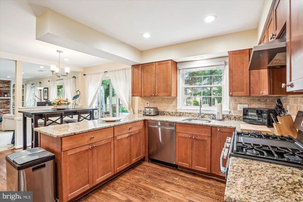 Chandelier, Dining room, Interior, Kitchen, Recessed Lighting, Stainless Steel Appliances, Wood Texture Flooring