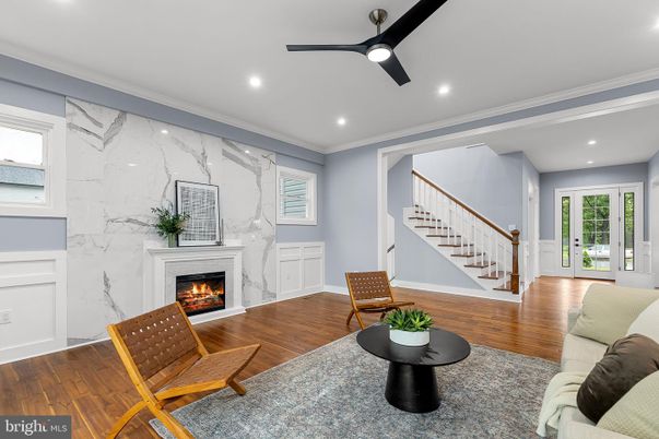 Fireplace, Interior, Living room, Marble Walls, Recessed Lighting, Wood Texture Flooring