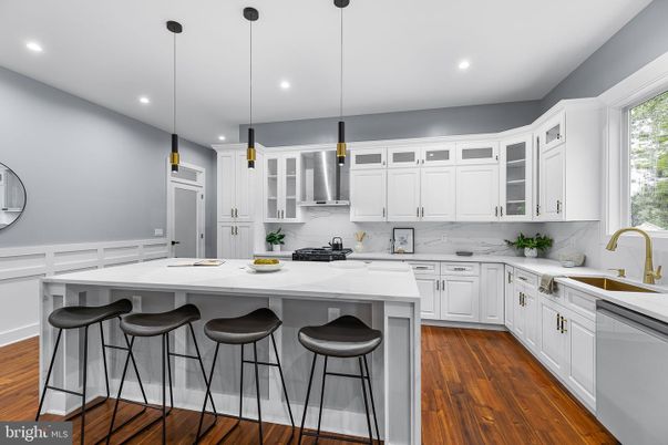 Interior, Kitchen, Marble Walls, Pendant Lights, Recessed Lighting, Stainless Steel Appliances, Wood Texture Flooring
