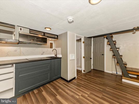 Interior, Kitchen, Marble Walls, Recessed Lighting, Stainless Steel Appliances, Wood Texture Flooring