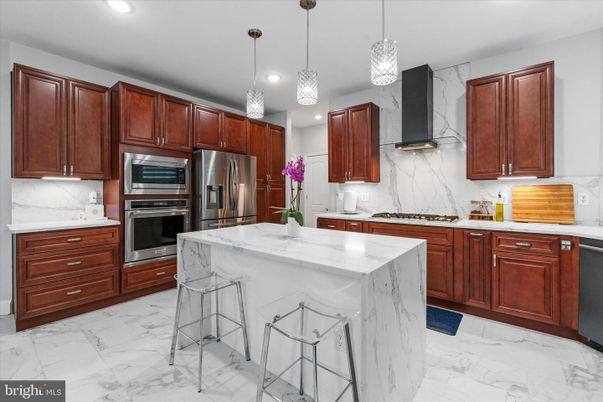 Interior, Kitchen, Marble, Marble Walls, Pendant Lights, Recessed Lighting, Stainless Steel Appliances