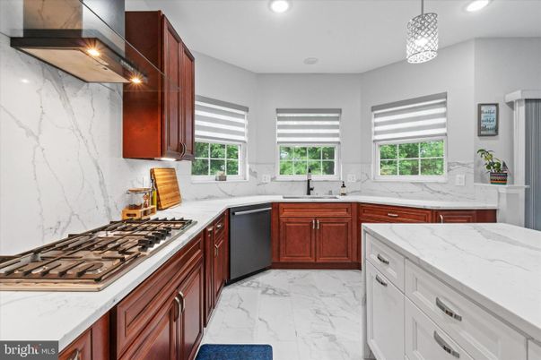 Interior, Kitchen, Marble, Marble Walls, Pendant Lights, Recessed Lighting, Stainless Steel Appliances