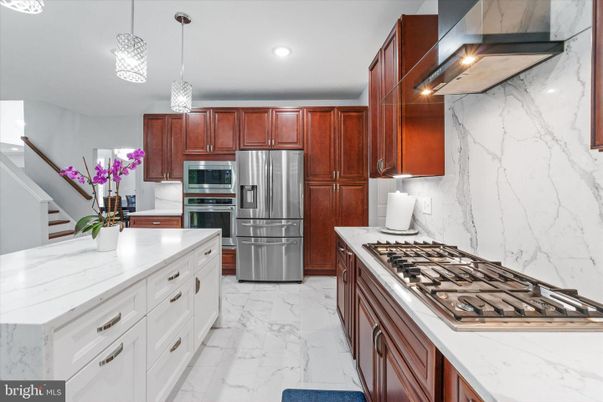 Interior, Kitchen, Marble, Marble Walls, Pendant Lights, Recessed Lighting, Stainless Steel Appliances