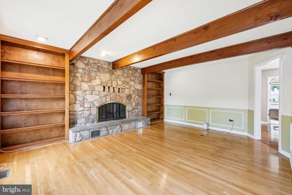 Empty room, Fireplace, Interior, Recessed Lighting, Stone Walls, Wooden Beams, Wood Texture Flooring