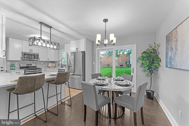 Chandelier, Dining room, Interior, Kitchen, Pendant Lights, Stainless Steel Appliances, Wood Texture Flooring