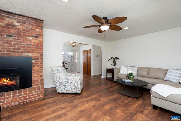 Fireplace, Interior, Living room, Recessed Lighting, Stone Walls, Wood Texture Flooring