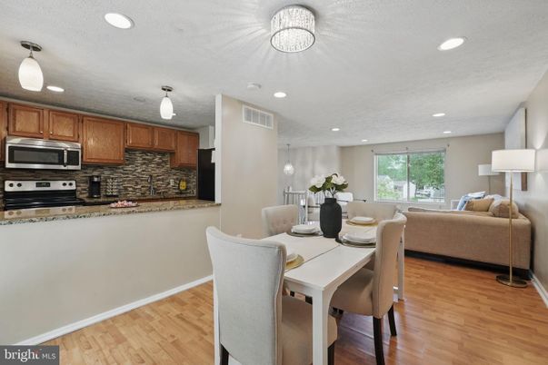 Dining room, Interior, Kitchen, Living room, Pendant Lights, Recessed Lighting, Stainless Steel Appliances, Wood Texture Flooring