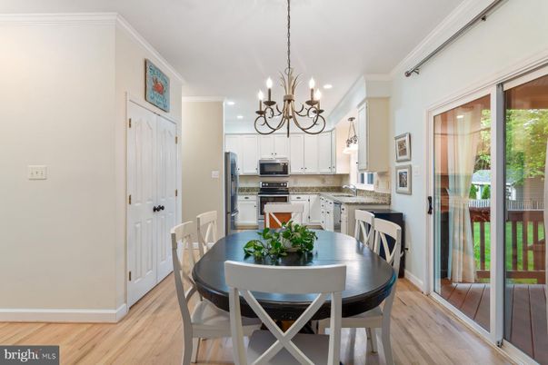 Chandelier, Dining room, Interior, Kitchen, Recessed Lighting, Stainless Steel Appliances, Wood Texture Flooring