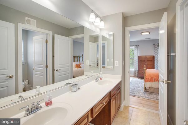 Bathroom, Dual Sink Vanities, Interior, Recessed Lighting, Wood Texture Flooring