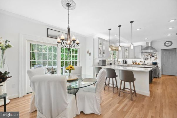Chandelier, Dining room, Interior, Kitchen, Pendant Lights, Recessed Lighting, Stainless Steel Appliances, Wood Texture Flooring