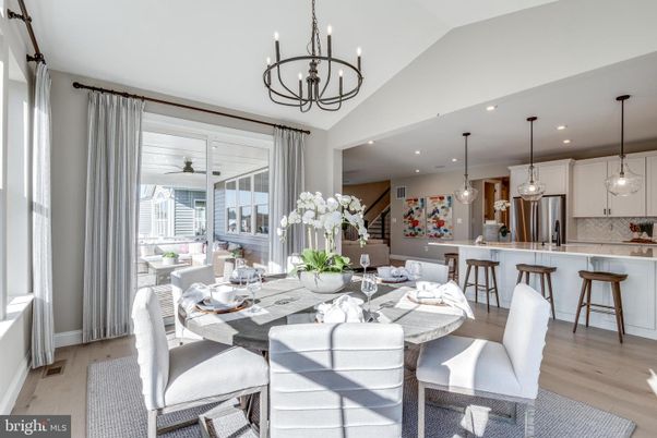 Chandelier, Dining room, Interior, Kitchen, Pendant Lights, Recessed Lighting, Stainless Steel Appliances, Wood Texture Flooring