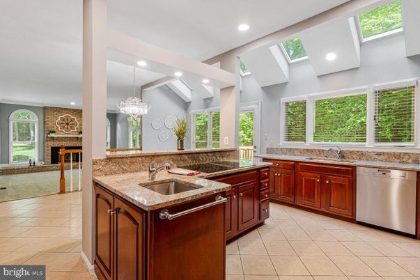 Fireplace, Interior, Kitchen, Recessed Lighting, Stainless Steel Appliances, Stone Walls