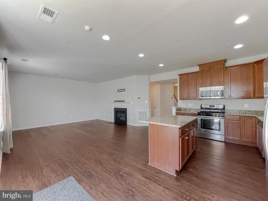 Fireplace, Interior, Kitchen, Recessed Lighting, Stainless Steel Appliances, Wood Texture Flooring