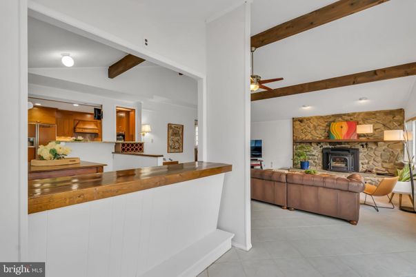 Fireplace, Interior, Kitchen, Living room, Recessed Lighting, Stone Walls, Wooden Beams