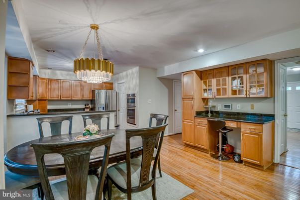 Chandelier, Dining room, Interior, Kitchen, Recessed Lighting, Stainless Steel Appliances, Wood Texture Flooring