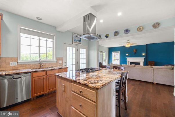 Fireplace, Interior, Kitchen, Living room, Recessed Lighting, Stainless Steel Appliances, Wood Texture Flooring