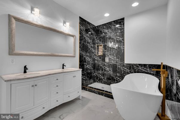 Bathroom, Dual Sink Vanities, Free Standing Baths, Interior, Marble, Marble Walls, Recessed Lighting