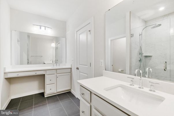Bathroom, Dual Sink Vanities, Glass Shower, Interior, Marble Walls, Recessed Lighting