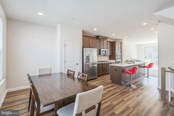 Dining room, Interior, Kitchen, Recessed Lighting, Stainless Steel Appliances, Wood Texture Flooring