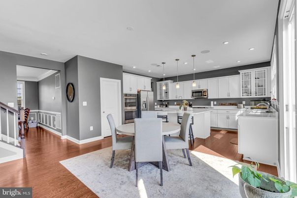 Dining room, Interior, Kitchen, Pendant Lights, Recessed Lighting, Stainless Steel Appliances, Wood Texture Flooring
