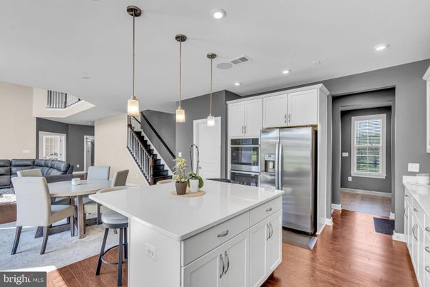 Dining room, Interior, Kitchen, Living room, Pendant Lights, Recessed Lighting, Stainless Steel Appliances, Wood Texture Flooring