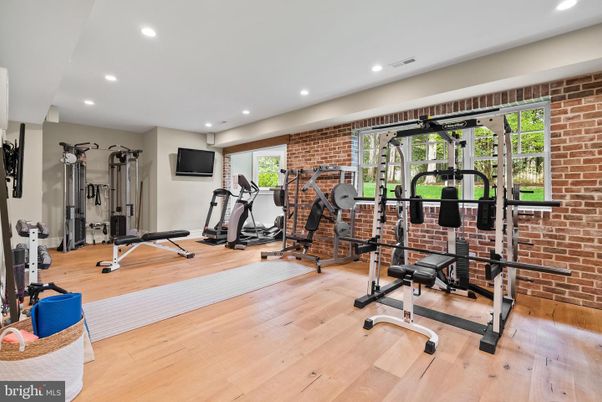 Fitness Equipment, Gym, Interior, Recessed Lighting, Stone Walls, Wood Texture Flooring