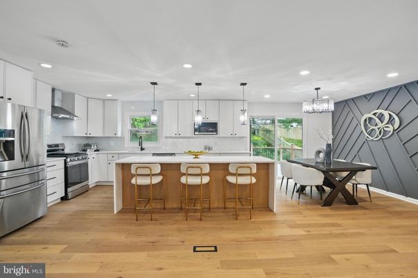 Chandelier, Dining room, Interior, Kitchen, Pendant Lights, Recessed Lighting, Stainless Steel Appliances, Wood Texture Flooring