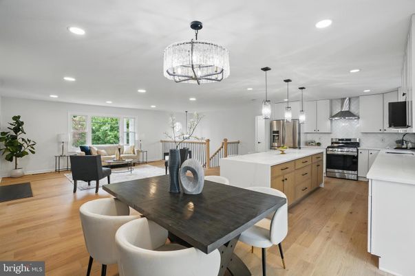Chandelier, Dining room, Interior, Kitchen, Living room, Pendant Lights, Recessed Lighting, Stainless Steel Appliances, Wood Texture Flooring