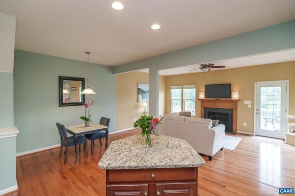 Dining room, Fireplace, Interior, Living room, Pendant Lights, Recessed Lighting, Wood Texture Flooring