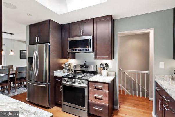 Dining room, Interior, Kitchen, Pendant Lights, Recessed Lighting, Stainless Steel Appliances, Wood Texture Flooring