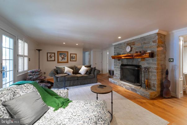 Fireplace, Interior, Living room, Recessed Lighting, Stone Walls, Wood Texture Flooring