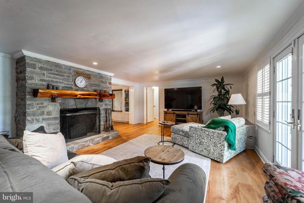 Fireplace, Interior, Living room, Recessed Lighting, Stone Walls, Wood Texture Flooring