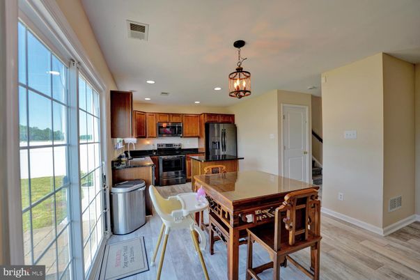 Dining room, Interior, Kitchen, Pendant Lights, Recessed Lighting, Stainless Steel Appliances, Wood Texture Flooring