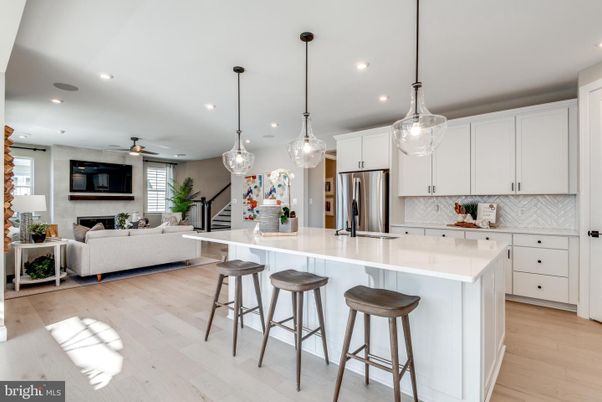Fireplace, Interior, Kitchen, Living room, Pendant Lights, Recessed Lighting, Stainless Steel Appliances, Wood Texture Flooring
