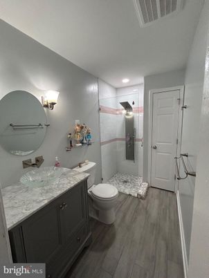 Bathroom, Glass Shower, Interior, Recessed Lighting, Wood Texture Flooring