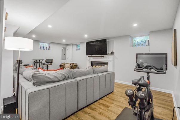 Fireplace, Fitness Equipment, Interior, Living room, Recessed Lighting, Wood Texture Flooring