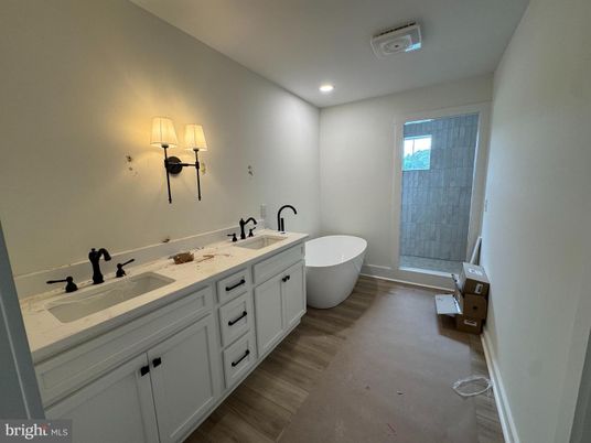 Bathroom, Dual Sink Vanities, Free Standing Baths, Interior, Recessed Lighting, Wood Texture Flooring