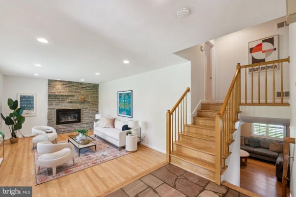 Fireplace, Interior, Living room, Recessed Lighting, Stone Walls, Wood Texture Flooring