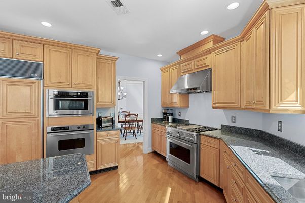 Dining room, Interior, Kitchen, Recessed Lighting, Stainless Steel Appliances, Wood Texture Flooring