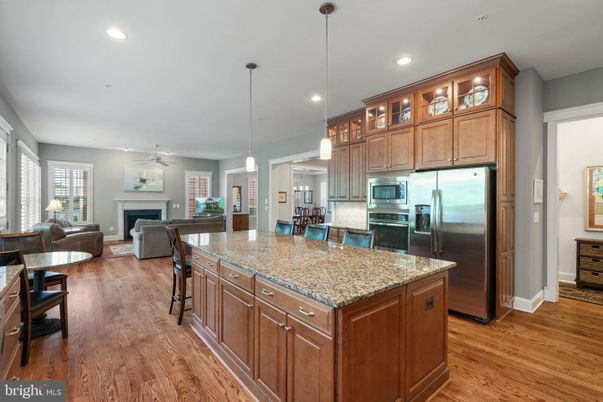 Fireplace, Interior, Kitchen, Living room, Pendant Lights, Recessed Lighting, Stainless Steel Appliances, Wood Texture Flooring