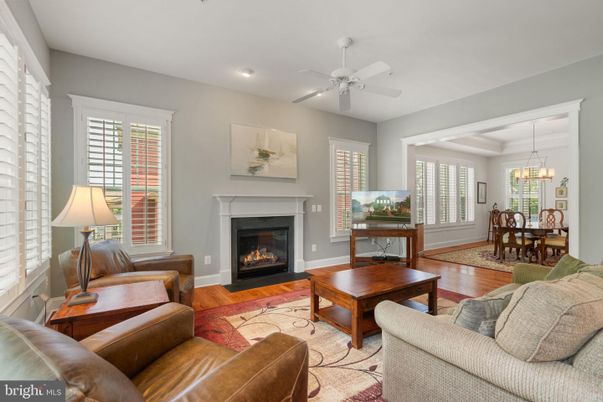 Chandelier, Dining room, Fireplace, Interior, Living room, Pendant Lights, Recessed Lighting, Wood Texture Flooring