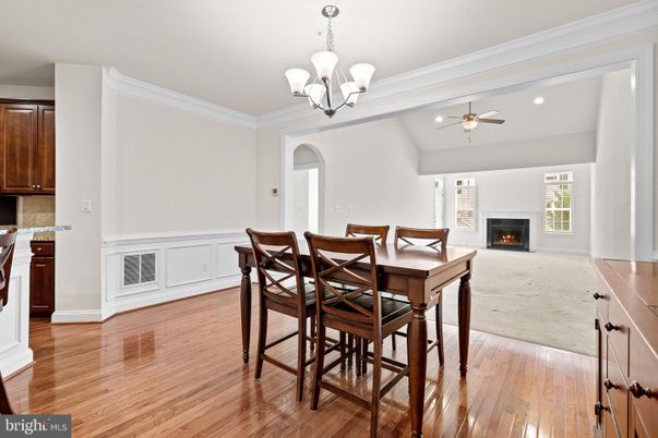 Chandelier, Dining room, Fireplace, Interior, Recessed Lighting, Wood Texture Flooring